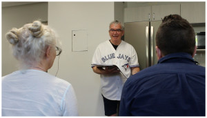 Director Maynard Morrison goes over script options with cast members Mary-Colin Chisholm and Peter MacInnis.